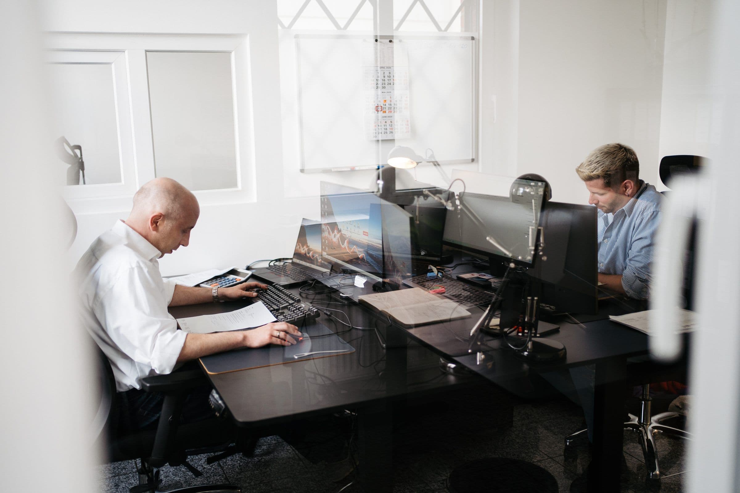 Mitarbeiter im Büro der HBO Immobilien in Köln
